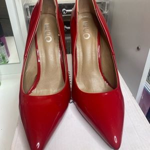 Red leather pumps